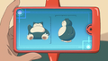 Goh's Rotom Phone measuring Snorlax's height